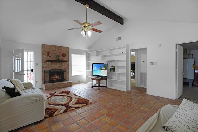 tiled living room featuring built in shelves, beam ceiling, a fireplace, water heater, and visible vents