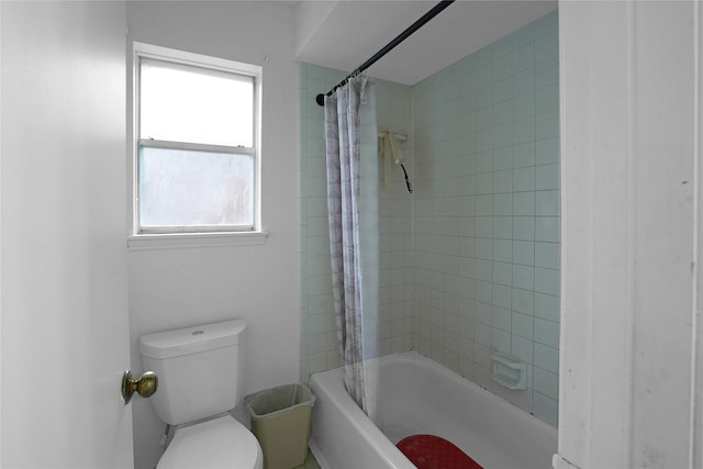 bathroom with shower / tub combo and toilet