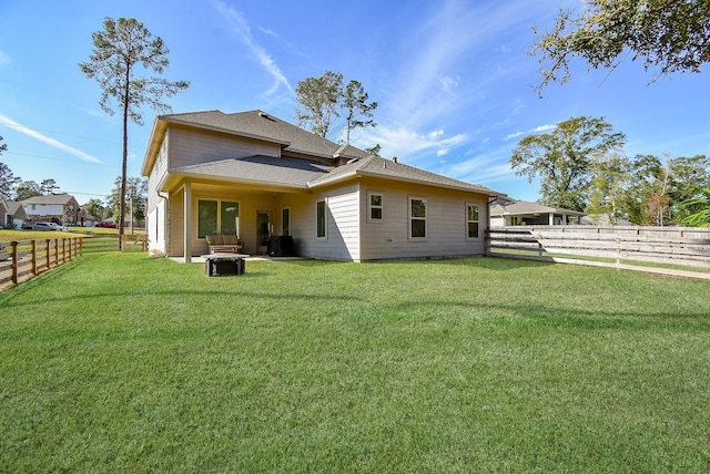 back of property featuring a fenced backyard and a yard