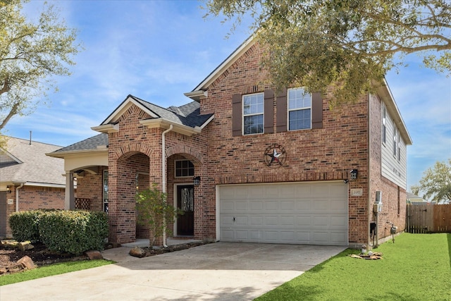 traditional-style house featuring a garage, brick siding, roof with shingles, and a front yard