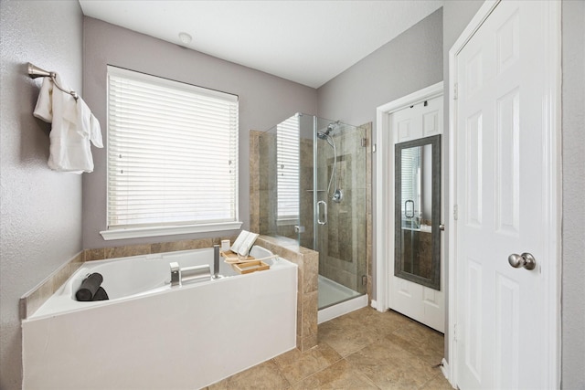 full bath featuring a shower stall and a bath