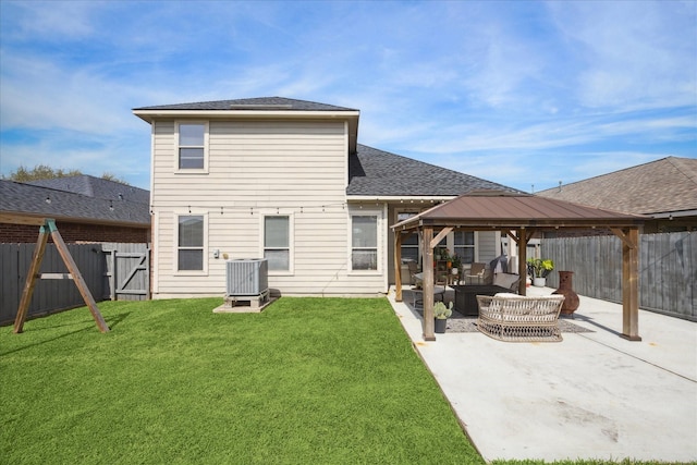 back of house with a yard, a patio, a gazebo, central AC unit, and a fenced backyard