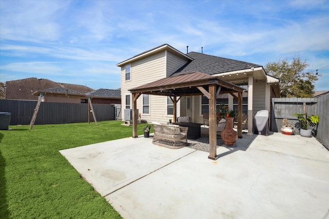 view of patio / terrace with a fenced backyard, an outdoor living space, and a gazebo