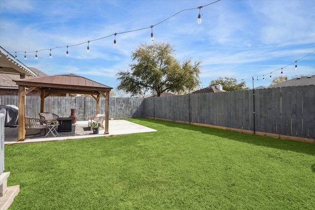 view of yard with a fenced backyard, a patio, and a gazebo