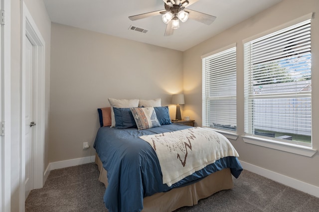 bedroom featuring carpet floors, baseboards, visible vents, and a ceiling fan