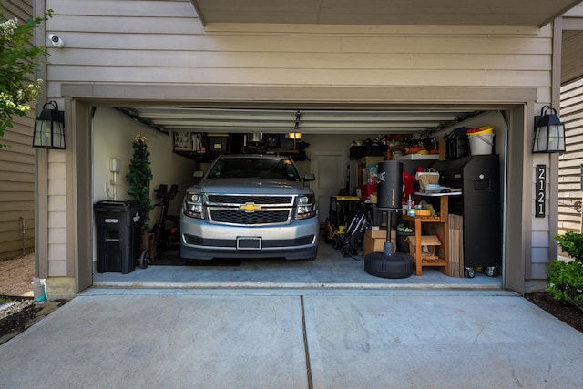 garage with concrete driveway