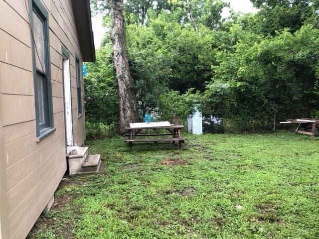 view of yard with entry steps