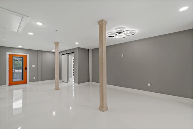 below grade area with recessed lighting and elevator