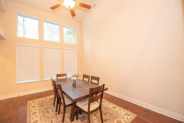 dining space featuring visible vents, baseboards, and wood finished floors