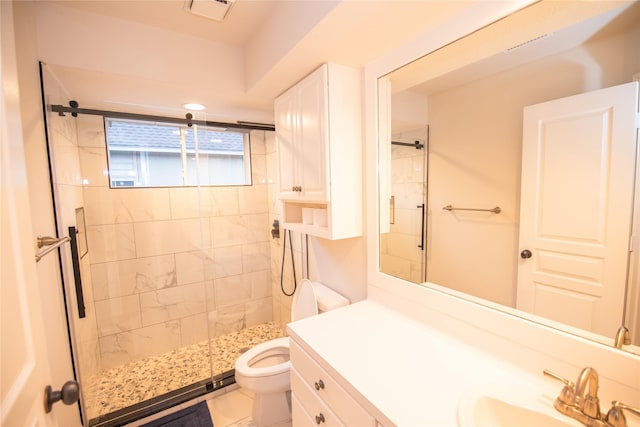 bathroom with toilet, a shower stall, visible vents, and vanity