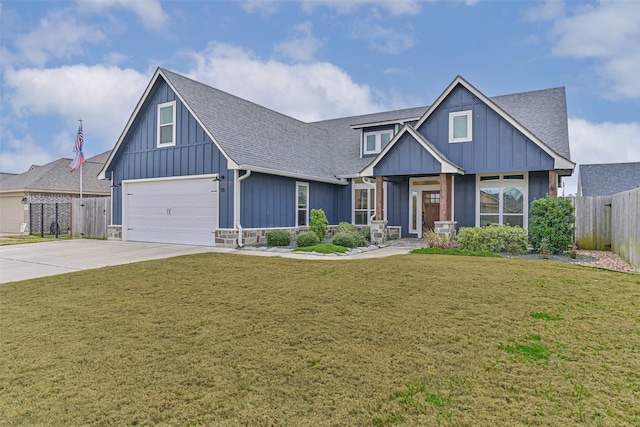 view of front of home with driveway, board and batten siding, a front yard, and fence