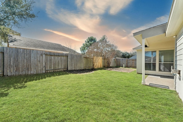 view of yard with a fenced backyard