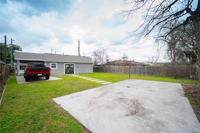 view of yard with a fenced backyard and a patio