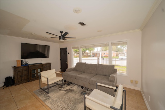 living area featuring visible vents, crown molding, baseboards, and light tile patterned floors