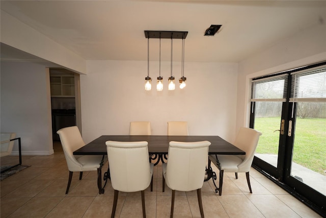 dining area with light tile patterned flooring