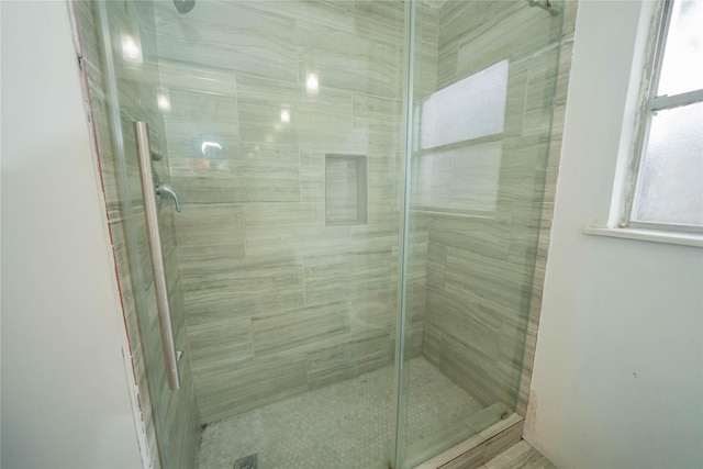 full bath featuring a shower stall