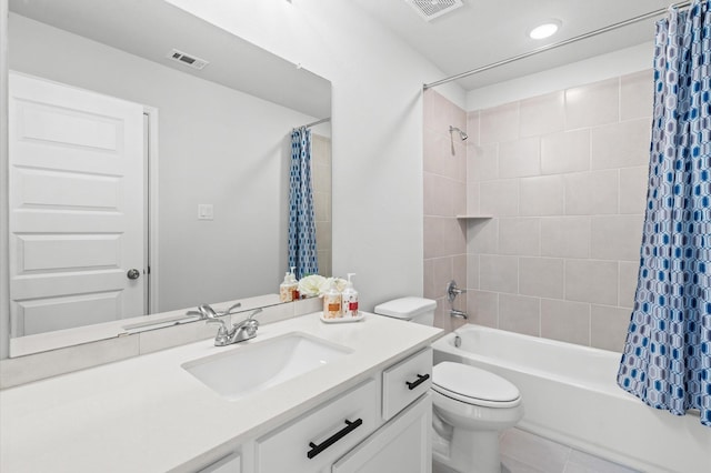 bathroom featuring visible vents, shower / bathtub combination with curtain, toilet, and vanity