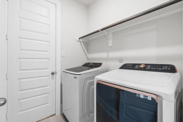 laundry room with laundry area and washing machine and dryer