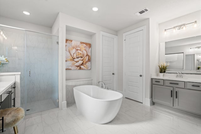 full bathroom with marble finish floor, a marble finish shower, a soaking tub, visible vents, and vanity