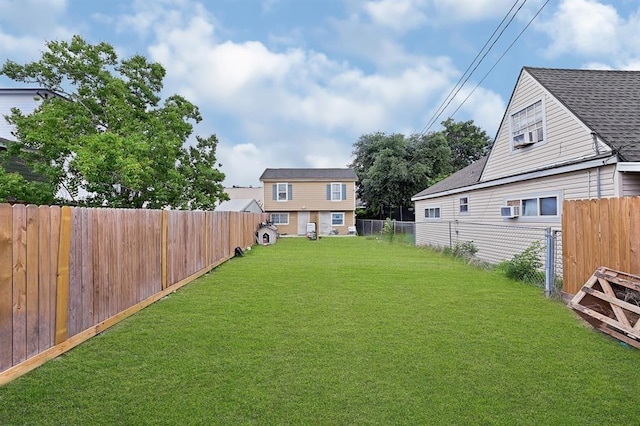 view of yard with a fenced backyard