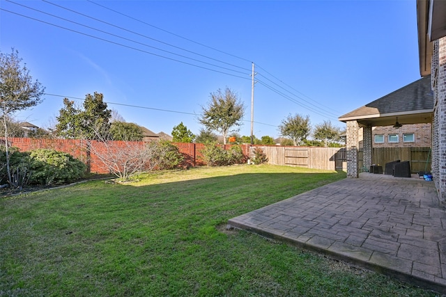 view of yard featuring a patio and a fenced backyard