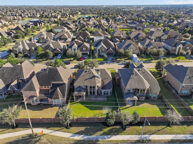 birds eye view of property with a residential view