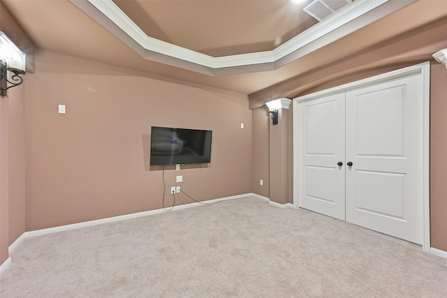 basement featuring ornamental molding, carpet flooring, visible vents, and baseboards