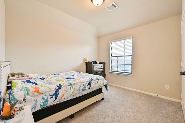 bedroom with carpet, visible vents, vaulted ceiling, and baseboards