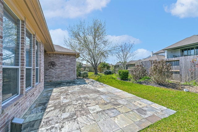 view of patio / terrace featuring fence