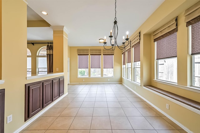 unfurnished dining area with light tile patterned floors, recessed lighting, baseboards, and a notable chandelier