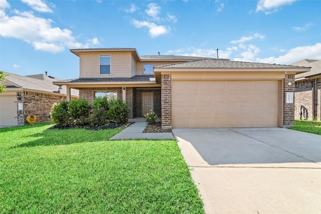 view of front facade with a front yard, concrete driveway, brick siding, and an attached garage