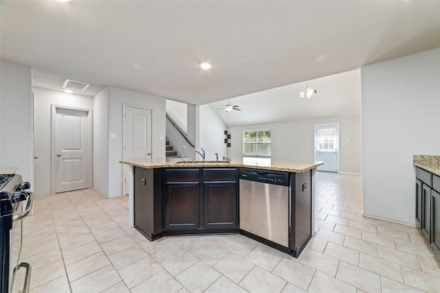 kitchen with stainless steel appliances, visible vents, a sink, and light stone countertops