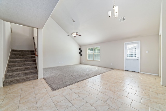 unfurnished living room featuring stairs, light tile patterned floors, light colored carpet, visible vents, and ceiling fan with notable chandelier