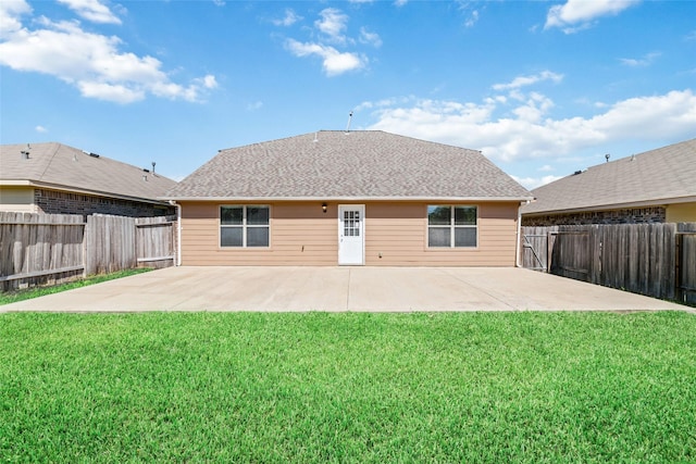 back of property with a fenced backyard, roof with shingles, a lawn, and a patio