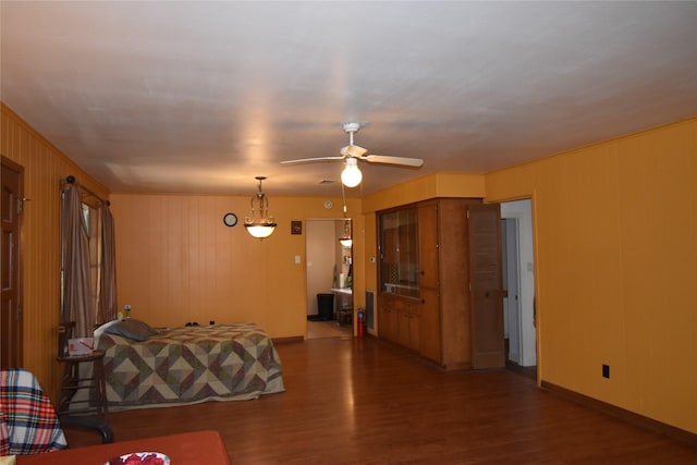 interior space featuring baseboards and wood finished floors