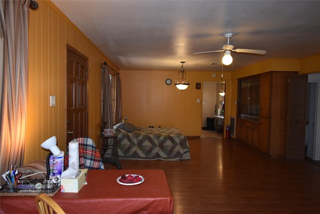 living room with ceiling fan and wood finished floors