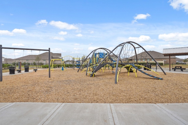 communal playground featuring fence