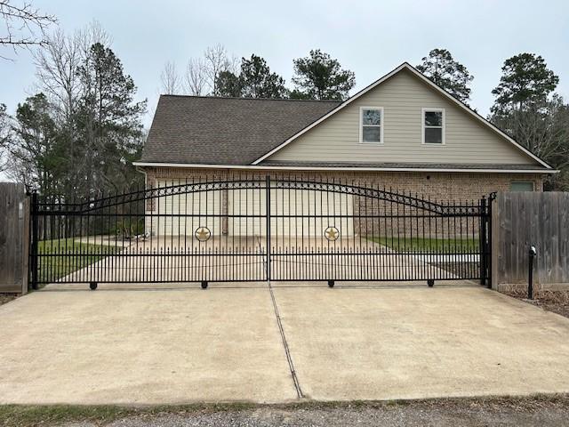 view of gate with fence