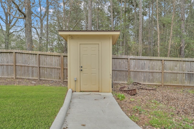 view of shed with a fenced backyard