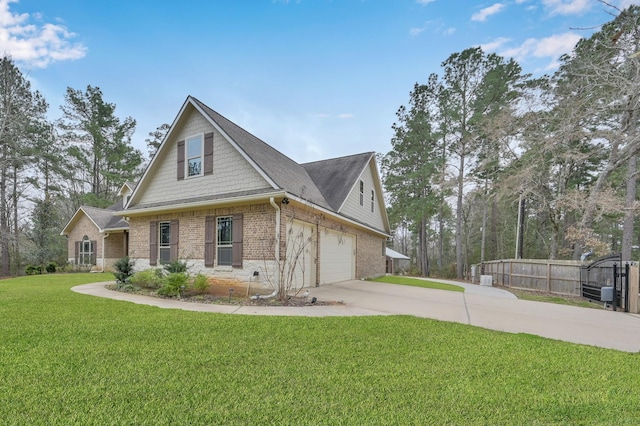 view of front of home with brick siding, a front yard, fence, a garage, and driveway