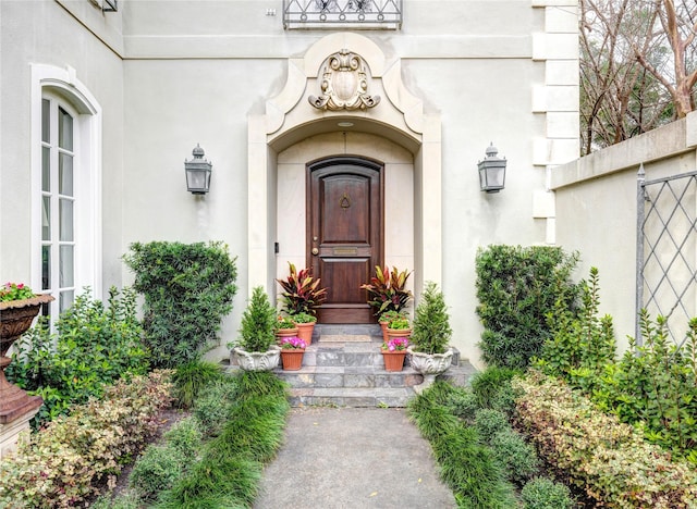 doorway to property with stucco siding