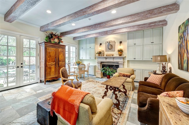 living room with beamed ceiling, stone tile flooring, french doors, a fireplace, and recessed lighting