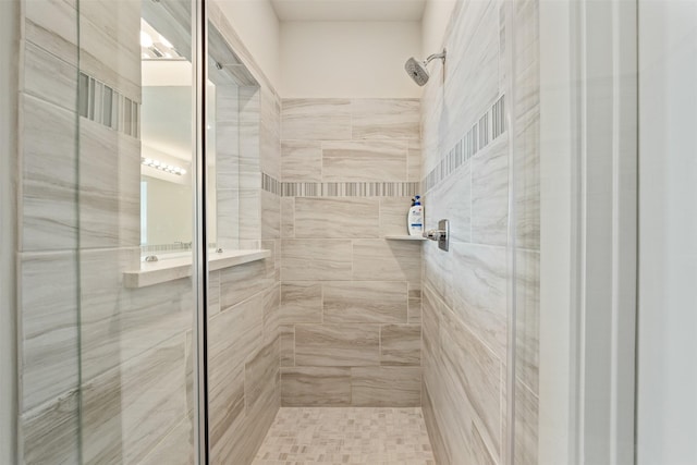 bathroom featuring a shower stall