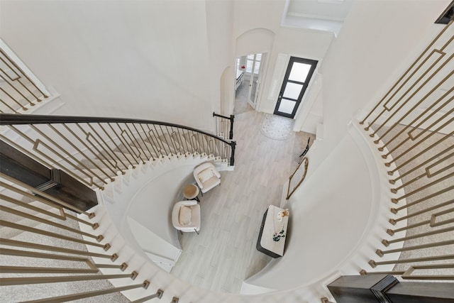 staircase featuring wood finished floors