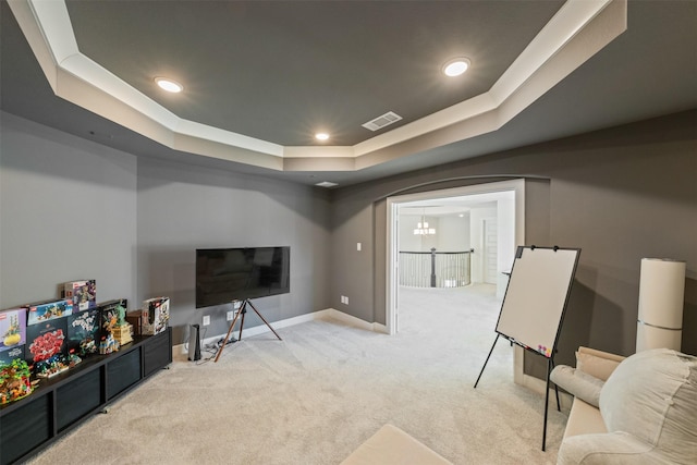 interior space featuring carpet floors, recessed lighting, a raised ceiling, visible vents, and baseboards