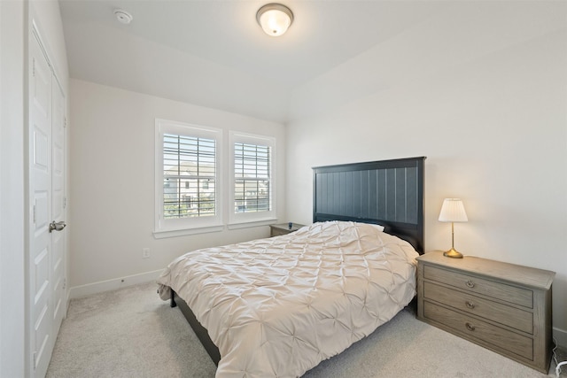 carpeted bedroom featuring baseboards