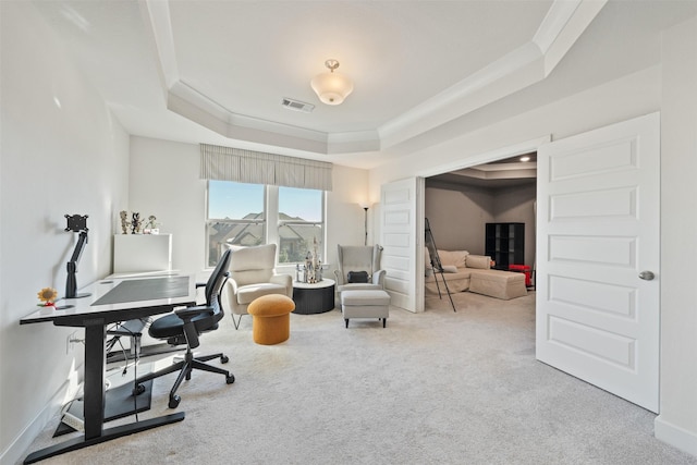 home office featuring carpet floors, a raised ceiling, visible vents, and crown molding