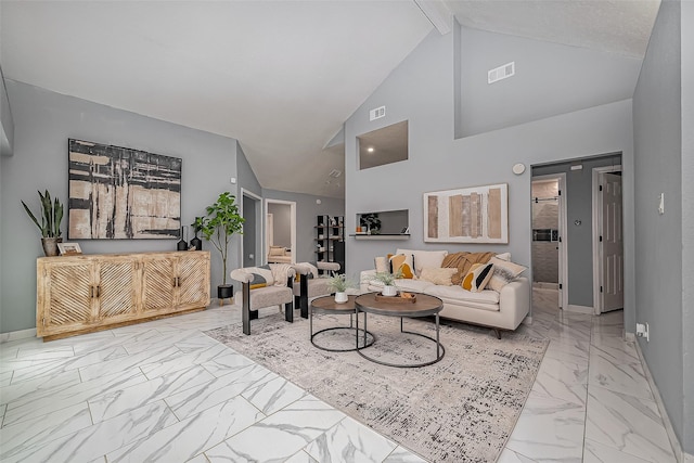 living room with marble finish floor, visible vents, beamed ceiling, and baseboards