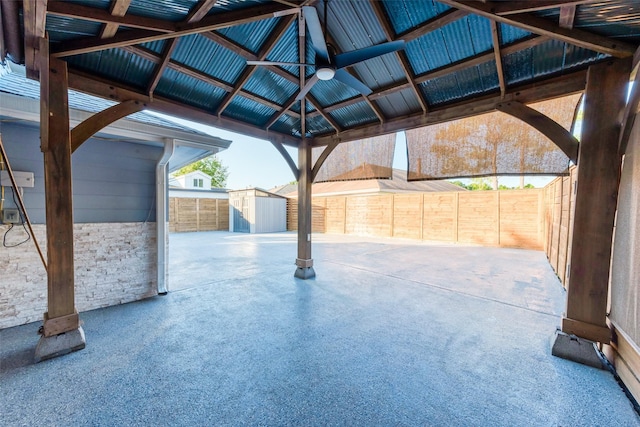 view of patio / terrace featuring a gazebo, an outdoor structure, a storage shed, and fence