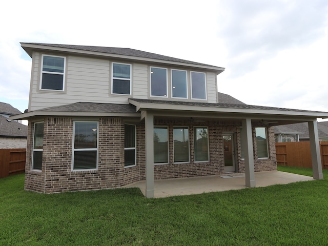 21706 Persian Lake Dr, Cypress, TX 77433 - back of property with brick siding, a patio area, and a shingled roof